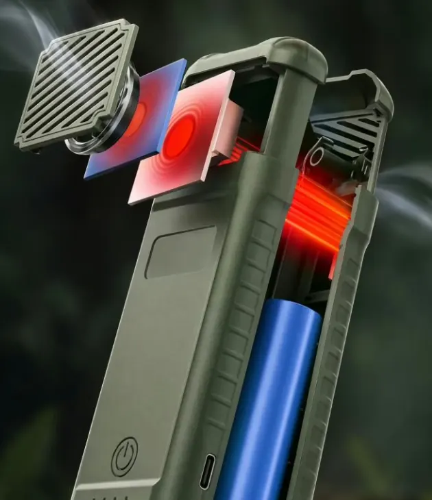 MoskiCell with its vent grille lifted away, showing the red heating plates around the tablet slot and the blue battery cell in the lower body